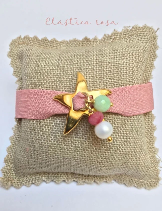 pulsera con estrella mar dorada con elástico ancho plano en color rosa pulsera con estrella mar dorada con elástico ancho plano en color rosa